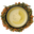 A cup of golden genmaicha seen from above, ringed by green tea leaves and roasted brown rice on a white background
