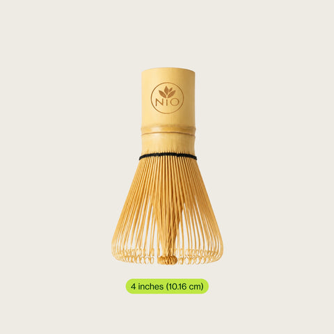 A bamboo whisk (chashaku) with a natural light wood handle and fine light bamboo bristles, shown on a light beige background with a green size label below.